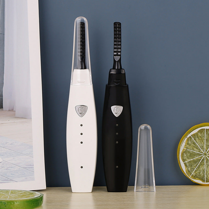 USB rechargeable heated eyelash curler with quick heating for naturally lifted, long-lasting curled lashes.
